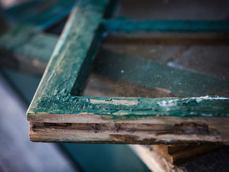 Window Restoration Cape Cod - Closeup of an old sash where the paint is peeling letting in water which will lead to rot